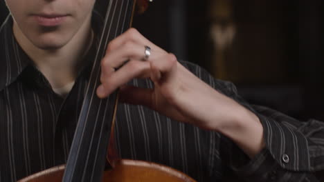 Tracking-In-Of-Male-Cellist-Playing