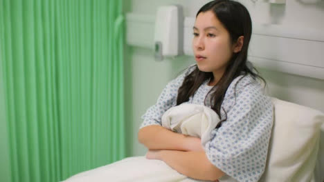 Female-Patient-in-Hospital-Bed