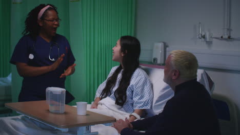 Female-Nurse-Gives-Patient-Good-News