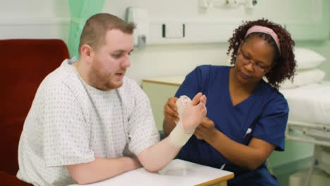 Nurse-Starts-Bandaging-Patients-Injured-Wrist