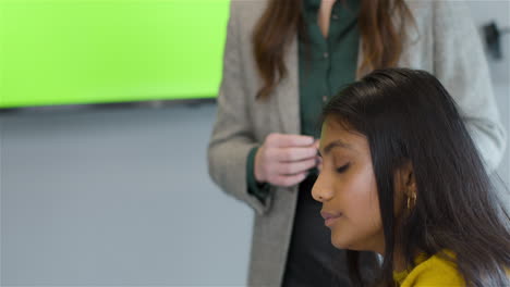 Tracking-Out-From-Woman-Talking-To-Colleagues-With-Green-Screen