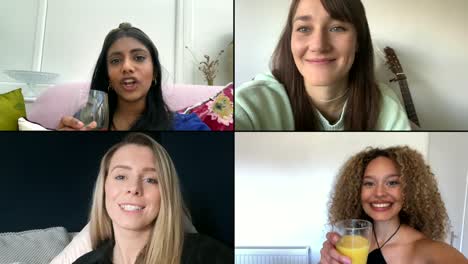Four-Female-Friends-Saying-Cheers-Over-Video-Chat-