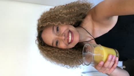 Video-Chat-African-American-Woman-Giving-A-Cheers-To-Friends