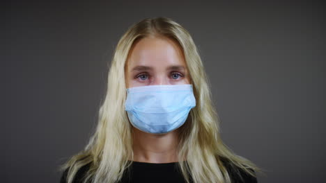 Young-Blonde-Woman-Wearing-Face-Mask