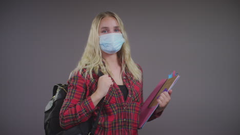 Young-Blonde-Female-Student-Wearing-Face-Mask