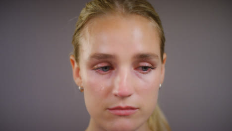 Close-Up-of-Emotional-Young-Blonde-Woman-Crying