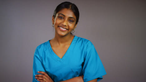 Friendly-Young-Female-Doctor-Smiling-at-Camera