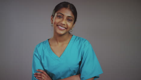 Friendly-Young-Female-Doctor-Smiling-at-Camera