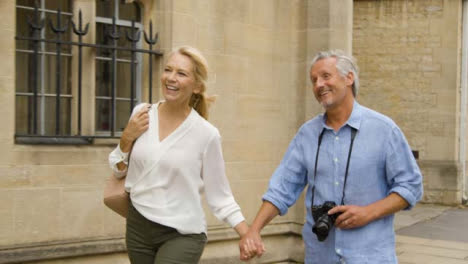 Tracking-Shot-of-Middle-Aged-Tourist-Couple-Enjoying-City-Break