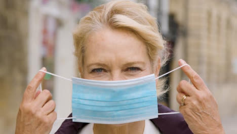 Close-Up-of-Middle-Aged-Woman-Wearing-a-Face-Mask-In-City