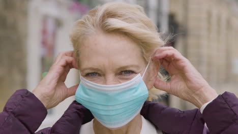 Close-Up-of-Middle-Aged-Woman-Wearing-a-Face-Mask-In-City