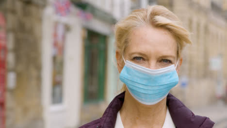 Close-Up-of-Middle-Aged-Woman-Wearing-Face-Mask-In-City