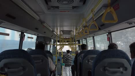 Bengaluru-Karnataka--India-Wide-angle-shot-of-the-inside-of-a-public-bus-during-day-time-less-crowded-due-to-corona-virus-fear