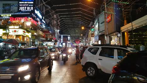 Bengaluru-Karnataka--India--October-26-2019-Wide-angle-view-of-the-lighting-decorations-in-Brigade-road-on-the-occasion-of-Diwali-festival-celebrations-and-vehicles-driving-through-the-road