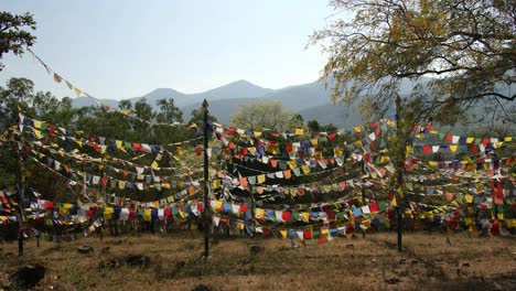 Beautiful-shot-of-colorful-Buddhist-flags-fluttering-in-wind-on-rope-during-a-bright-sunny-day