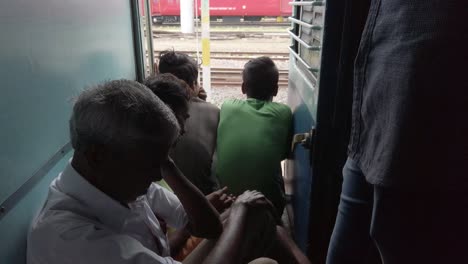 Ambur-Tamilnadu--India--March-24-2020-Public-travelling-without-masks-in-a-train-before-the-country-was-locked-down-due-to-Coronavirus-Covid19-pandemic