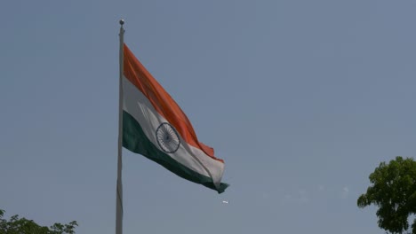 Close-up-view-of-a-giant-Indian-flag-fluttering-in-heavy-wind
