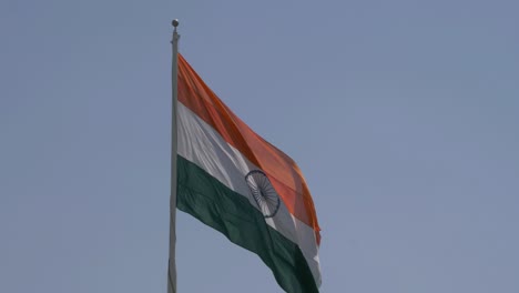 Close-up-of-giant-Indian-flag-fluttering-in-heavy-wind