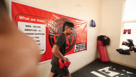 Bengaluru,-Karnataka-/-India---February-13-2020:-Close-up-of-two-mixed-martial-arts-fighters-practicing-elbow-shots-inside-a-dojo-during-day-time
