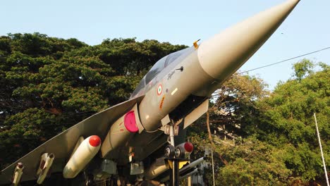 Medium-wide-top-to-bottom-tilt-shot-of-the-LCA-aircraft-installed-in-Cubbon-park-circle-by-HAL-in-Bengaluru,-Karnataka,-India