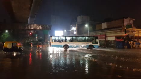 Bengaluru,-Karnataka-/-India---May-26-2019:-Vehicles-passing-through-MG-road-junction-during-heavy-rain-and-flooding