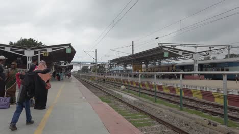 Jolarpettai-Tamilnadu--India--March-17-2020-Wide-angle-panning-shot-of-a-nearly-empty-railway-station-due-to-corona-virus-threat-on-an-overcast-day-
