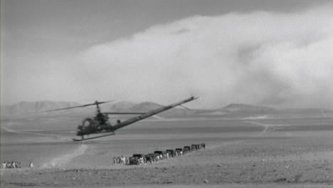 1950s-Light-Helicopter-Flying-Low-Through-the-Desert