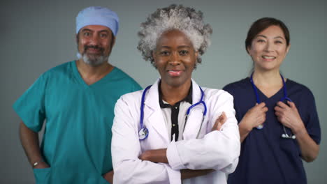 Three-Approachable-Middle-Aged-Doctors-Smiling-Portrait