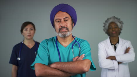 Pull-Focus-of-Three-Middle-Aged-Doctors-Looking-Concerned-Portrait