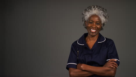 Middle-Aged-Nurse-Folds-Her-Arms-and-Smiles-Portrait