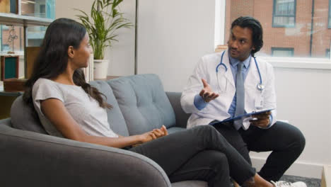 Young-Woman-Having-Chat-with-Doctor