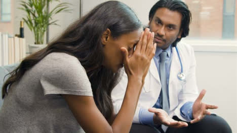 Young-Woman-Receives-Difficult-News-from-Doctor