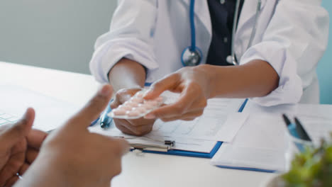 Doctor-Handing-Medication-To-Patient