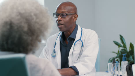 Approachable-Middle-Aged-Doctor-Talks-with-Patient