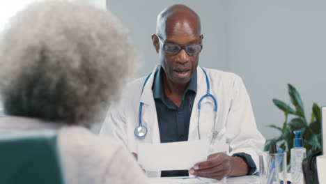 Approachable-Middle-Aged-Doctor-Talks-with-His-Patient