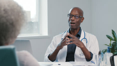 Positive-Middle-Aged-Doctor-Talks-with-His-Patient