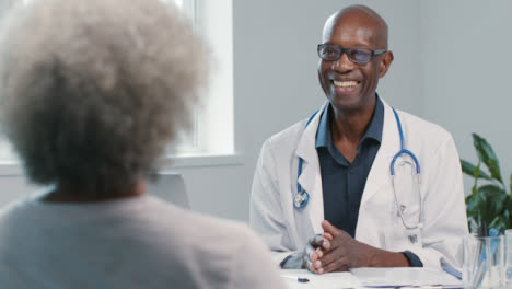 Positive-Middle-Aged-Doctor-Talks-with-Patient