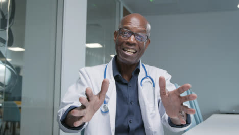 Middle-Aged-Doctor-Receives-Good-News-During-Video-Call