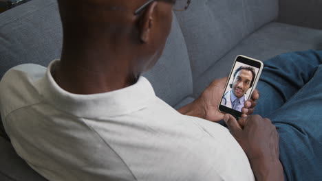Middle-Aged-Man-Listening-to-Doctor-During-a-Video-Call