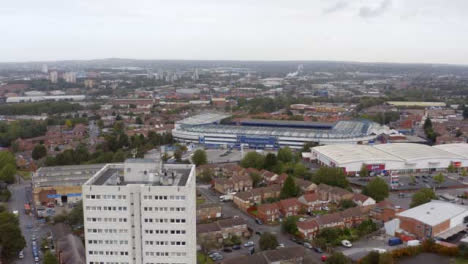 Drone-Shot-Rising-Above-Block-of-Flats-Looking-Over-St-Andrew's-Stadium