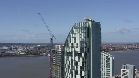 Drone-Shot-Orbiting-Skyscrapers-On-Sea-Front-03