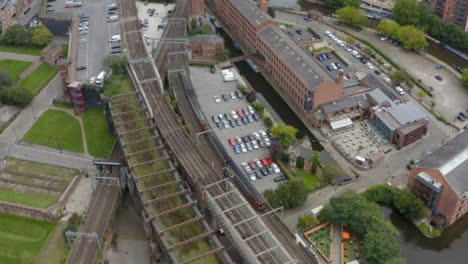 Drone-Shot-Tracking-Train-Travelling-Through-Castlefield-Canals-01