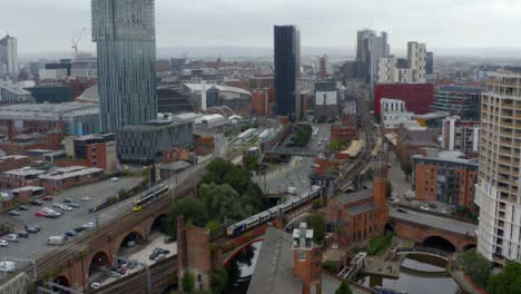 Drone-Shot-Tracking-Train-Travelling-Through-Castlefield-Canals-02