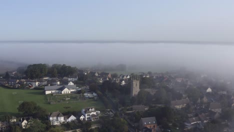 Drone-Shot-Orbiting-Islip-Church-In-Mist-04