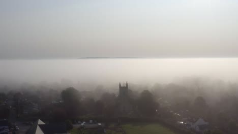 Drone-Shot-Orbiting-Islip-Church-In-Mist-07