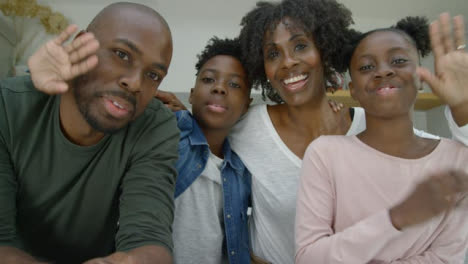 Joyful-Family-Talking-and-Waving-Goodbye-Directly-into-Webcam-During-Video-Call