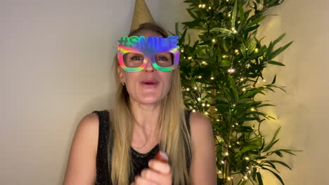 Young-Woman-On-Video-Call-Counting-Down-to-Midnight-and-Celebrating-Turn-of-the-New-Year