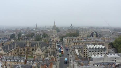 Drone-Shot-Pulling-Away-From-Buildings-In-Misty-Oxford