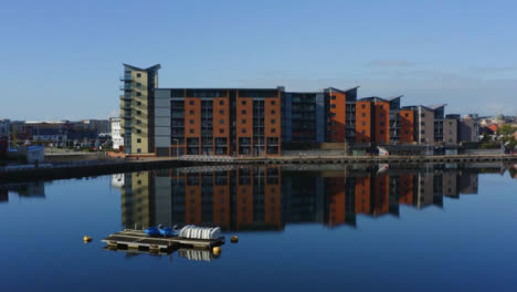 Drone-Shot-Rising-Over-Apartment-Buildings-Revealing-Swansea-Marina-Short-Version-1-of-2