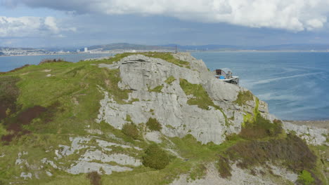 Drone-Shot-Flying-Past-Cliff-Revealing-Mumbles-Pier-In-Swansea-01